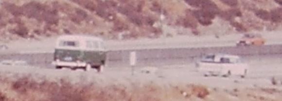 Snip of slide one showing VW Bus and Ford Pick Up driving on to teh on ramp.