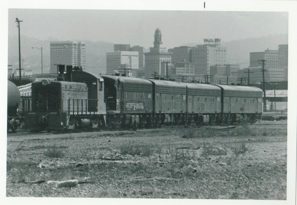 Train engines with City of Oakland California behind. 